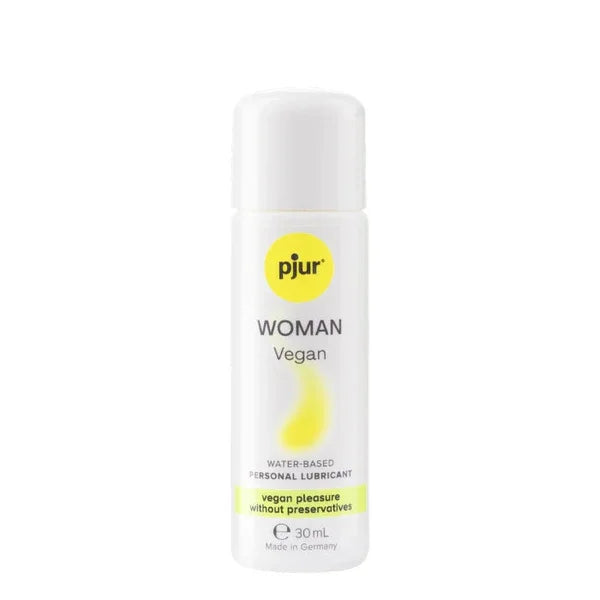 A sleek white bottle of pjur woman vegan water based personal lubricant with minimalist design and bold yellow accents