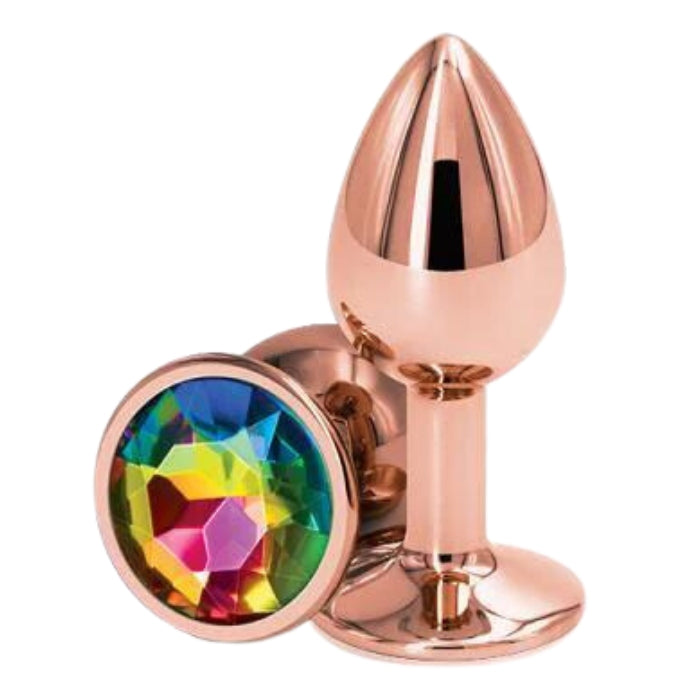 Rear Assets Rose Gold Anal Plug with Rainbow Stone Round - Small. Anal play has never been a prettier sight with this gorgeous jeweled, steel anal plug. Bulbous in form, a tapered tip ensures an easy introduction, while the broad steel bulb fills and satisfies. Perfect for anal enthusiast.