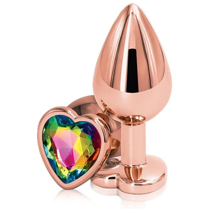 Rear Assets Rose Gold Anal Plug with Rainbow Stone Heart - Small. Anal play has never been a prettier sight with this gorgeous jeweled, steel anal plug. Bulbous in form, a tapered tip ensures an easy introduction, while the broad steel bulb fills and satisfies. Perfect for anal enthusiast.