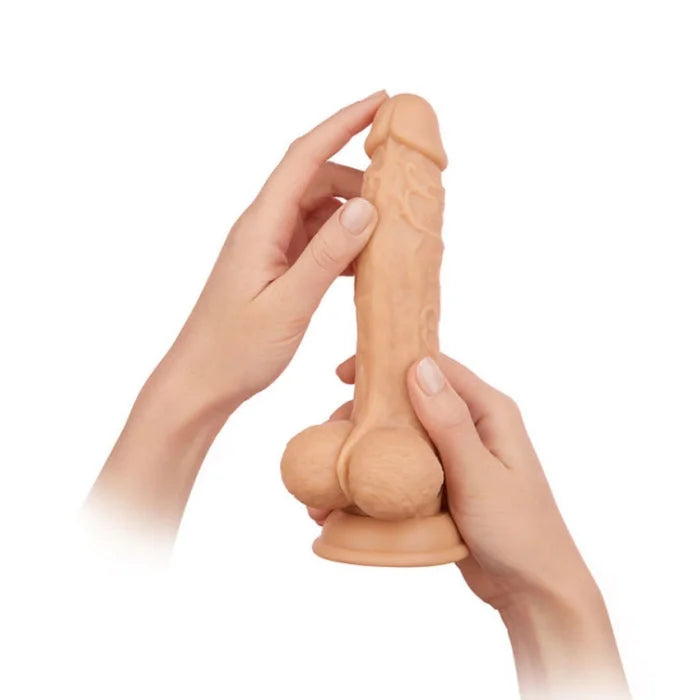 Beige premium liquid silicone rotating femme funn scrotum vibrating dildo with textured surface and turbo button