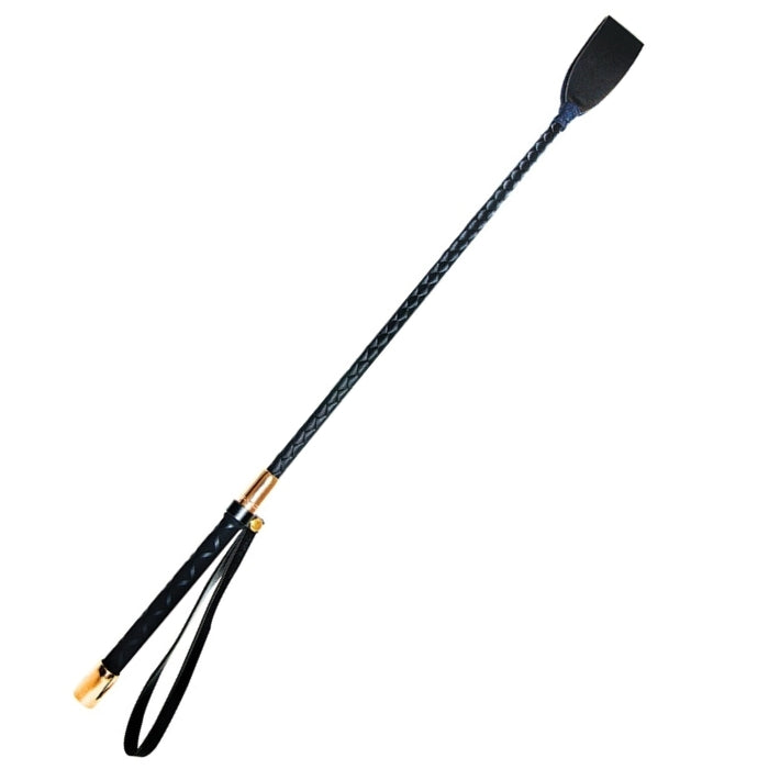 A vegan leather looped head riding crop. The tightly webbed, hand-wrapped shaft is springy and strong and leads the eye to the sturdy and elegant handle. A wrist loop makes it easy to stow at a moments notice. The rose gold caps that adorn the handle add another luxurious dimension to this solid, sleek, and striking implement of impact.