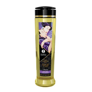 Golden-yellow shunga libido exotic fruits massage oil in a transparent bottle with black cap and illustrated couple label