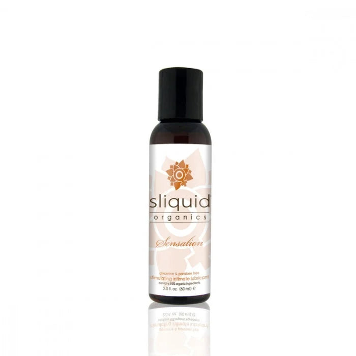 A sleek dark amber glass bottle of Sliquid Organics Sensation stimulating lubricant with black cap and orange floral logo