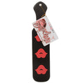 exotically contoured black paddle with 3 red lips on either side.