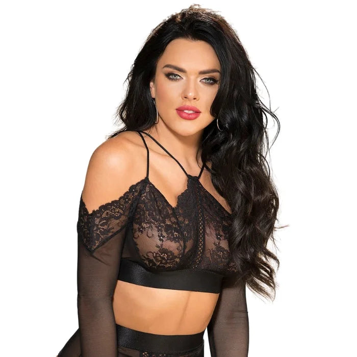 The crop top features a combination of stretch lace and mesh materials, which create a sexy and alluring look. The long sleeves of the crop top feature an opening at the cuff, which adds a touch of edginess and sexiness to the piece. The strappy open back of the crop top is a real showstopper, featuring multiple straps that create a unique and daring look. The hook back closure provides a secure and comfortable fit, while also adding a touch of sophistication to the piece.