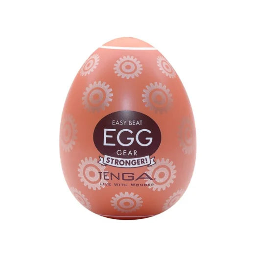Peach-colored tenga egg stronger gear with glossy finish and white gear decals made of body-safe elastomer