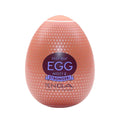 Peach-colored tenga egg stronger misty ii with textured body-safe elastomer surface for lady jane adult shop use