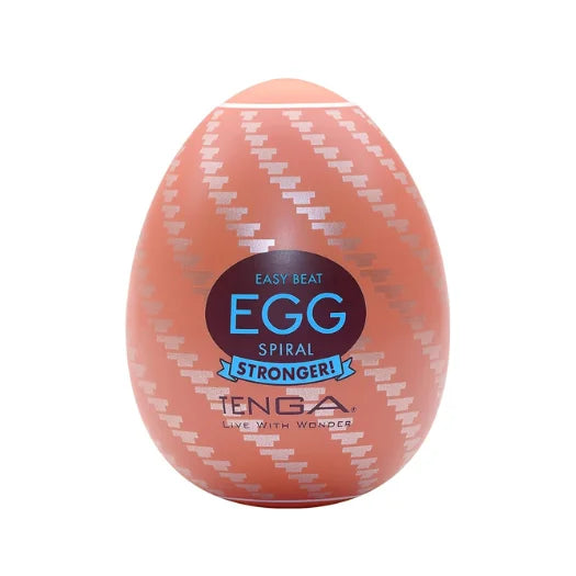 Peach-colored tenga real stronger spiral egg with white zigzag pattern and blue branding for total discretion use