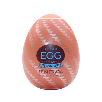 Peach-colored tenga real stronger spiral egg with white zigzag pattern and blue branding for total discretion use