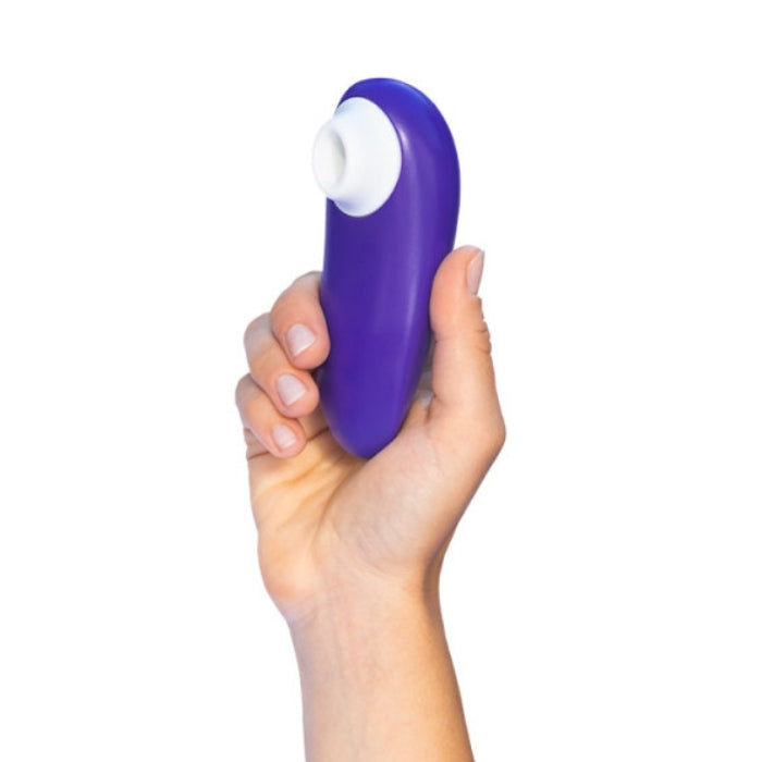 Womanizer Starlet 3 indigo clitoral stimulator with purple silicone toy and white base