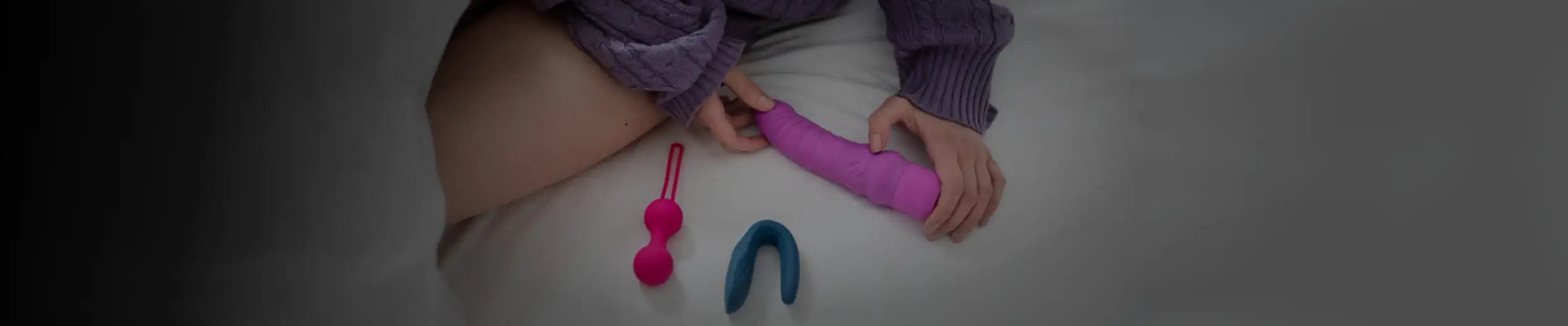 Pink silicone dildo with textured grip and rounded head