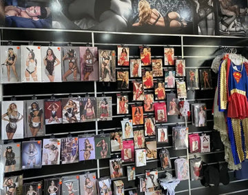 A red and blue superman costume with gold trim hanging on a rack.