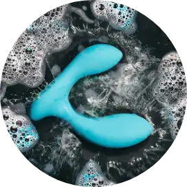 A sleek, light blue silicone toy with a smooth, curved design.