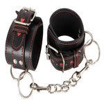 Strong padded adjustable cuffs with chain in between. Embellished with sexy little hearts for those who might enjoy a more playful unthreatening look for a new sub maybe.