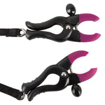 Bad Kitty Spreader String with Bullet Vibrator! A black g-string with clamps for the labia to expose the clitoris, the string also has a small vibrator that is attached to the stimulating pearls for the clitoris. You can adjust the intensity of the clamps with the adjusting screws. Total length 69 cm long (stretchable and adjustable), length of each clamp 6 cm. For extra stimulation use a clitoral gel.