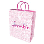 10-inch gift bag has a white background with pale pink flocking and matching metallic stamped loveable on front and back.