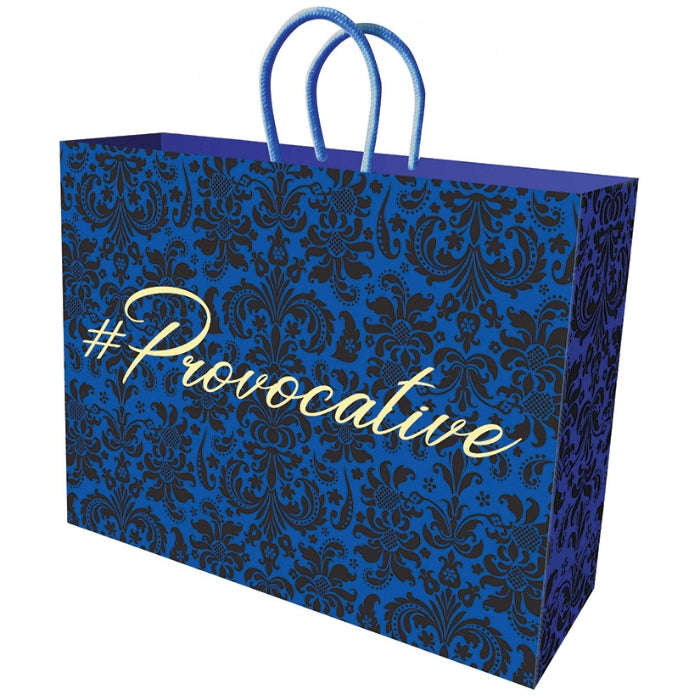 royal blue 12 by 5. inch gift bag with velvet-like flocked pattern. Has an imprinted gold foil stamp saying "Provacative".