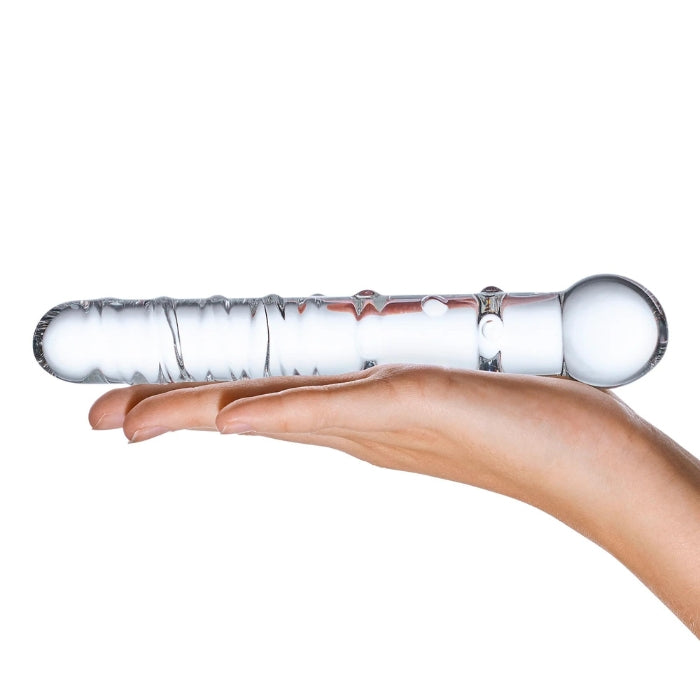 Glas Callisto Clear Glass 7 inch Dildo with ridges and nubs along the shaft.  On hand to show length comparison.