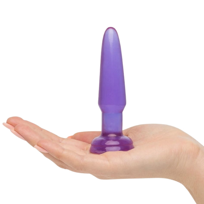 Jelly Rancher Anal Plug Trainer Kit! This set comes with 3 butt plugs in graduating sizes, perfect for beginners who are looking to work their way up to a fuller feeling. All the plugs have a slim, tapered design for comfortable insertion and a flared suction cup base that acts as a stopper for safe and easy removal. Purple (middle) on hand.
