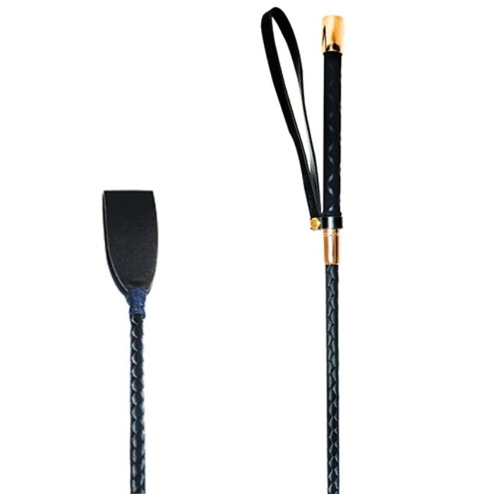 A vegan leather looped head riding crop. The tightly webbed, hand-wrapped shaft is springy and strong and leads the eye to the sturdy and elegant handle. A wrist loop makes it easy to stow at a moments notice. The rose gold caps that adorn the handle add another luxurious dimension to this solid, sleek, and striking implement of impact.