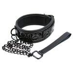 Wet look adjustable collar with detachable chain leash. Handle on leash is fake leather.